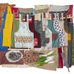 Fabric quilt that depicts aprons and other items found in a store in South Korea