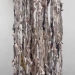 Close up of newspaper tendrils suspended from the ceiling