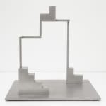 Abstract sculpture created from geometric shapes on a flat platform