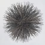 Artwork composed of a circular starburst shaped bundle of wire rope