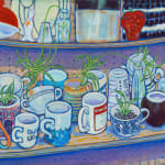 Tabletop piled with ceramic cups and mugs
