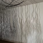 Bundles of wire rope hanging from wire net