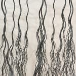 Detail of bundles of wire rope hanging from wire net