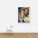 Multicolored abstract painting on paper with washes, stripes, and globs on a wall