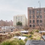 Tall wire sculpture with a bent semi circle on top