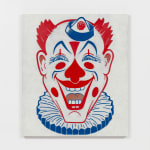 Red and blue graphic clown face against white background on white wall