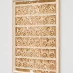 a laser sculpted paper sculpture on a white wall