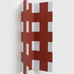 red and white sculpture on wall side view
