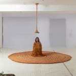 Neto sculpture hanging from the ceiling