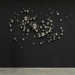 Eliasson crystal sphere sculpture on black wall