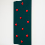 Green board with red circular objects