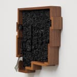an ink of computer circuit board sculpture on a white wall