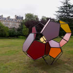 a large scale module sculpture in a green parka large scale module sculpture in a green park