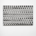 a grid of faces in black and white on a panel