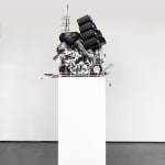 Sculpture with various china, ceramic, kitchen utensils and modified dishwasher on pedestal