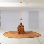 Neto sculpture hanging from the ceiling