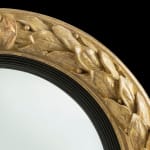 antique Coulborn Regency carved giltwood convex mirror laurel