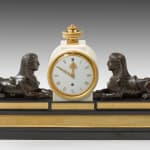 Patinated and Gilt Bronze Mounted Marble Mantel Timepiece