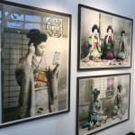Framed Geisha Girls prints hung on wall