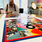 Sir Peter Blake signing The Who album cover