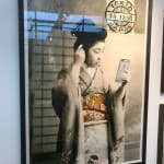 Geisha Girl holding iPhone framed