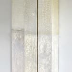 Silver, mixed leaf panels hung on wall