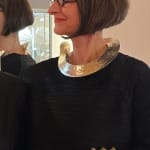 ute decker wearing one of her sculptural necklaces at Goldsmiths' Fair