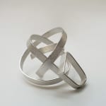 architectural jewellery - curling spaces ring - in recycled silver by architectural jewellery artist Ute Decker