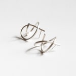 Sculptural earrings – thin curl – 100% recycled silver by contemporary jewellery artist Ute Decker