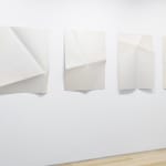 Series of white folded paper pieces
