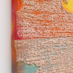 detail of light brown paint pushed through orange and blue dyed burlap