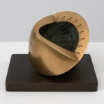 small bronze sculpture with a green inside
