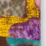 detail of yellow and brown paint pushed through purple dyed burlap