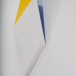 Detail of Tridimensional painting of a yellow, beige & white prism with triangular sides, looking like a cut gem