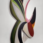 a colorful abstract painting on irregularly shaped wood panels assembled in a geometric formation with negative space hangs on a white wall