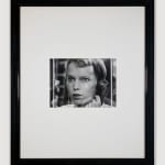 Framed black and white photograph of Mia Farrow looking out the window on the phone, with a tense look on her face, on the set of “Rosemary's Baby”