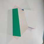 Green side detail of Tridimensional painting of interconnected prisms resembling a cut gem, with red shadow