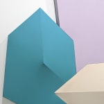 Detail of Tridimensional painting of a lavender prism with a smaller blue cube to the bottom left, a creme parallelepiped at the bottom center, and a pink triangular prism to the right