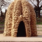 Exterior of a domed structure made of military sandbags
