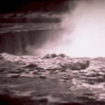 Black and white video still of Niagara Falls from above