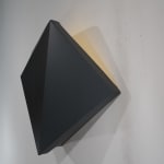 Detail of Tridimensional painting of a black prism with triangular sides, looking like a cut gem