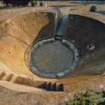 Photograph of an empty ditch in the shape of a circle in a remote outdoor location