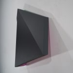 Detail of Tridimensional painting of a black & violet prism with triangular sides, looking like a cut gem