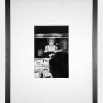 Framed black and white photograph of Marilyn Monroe looking at her makeup in the dressing room mirror of Carol Haney in New York City, 1954