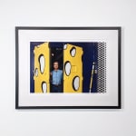 Framed Photograph of Roy Lichtenstein opening double doors painted yellow with white spots outlined with black