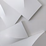 Detail of Large, white tridimensional painting composed of modules in a semicircle