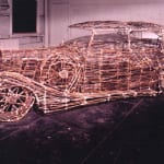 Sculpture of a car made of twigs, tree branches, bamboo, twine, adhesive to bind knots