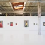 Hosfelt Gallery, looking at the east gallery on the north wall. On the left, four paintings of a man from behind with red hair and a red shirt, in various sizes. On the right, another series of four paintings of a woman from behind in a green low-back dre