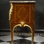 Charles Cressent (after), A pair of late eighteenth early nineteenth century Rococo style commodes after Charles Cressent, Paris late eighteenth...