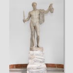A Pentelic marble sculpture depicting the mythological story of Perseus beheading Medusa.